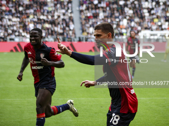 Cagliari midfielder Razvan Marin (18) celebrates after scoring his goal to make it 1-1 during the Serie A football match number 7, Juventus...