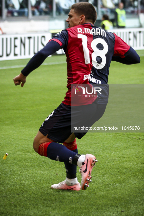 Cagliari midfielder Razvan Marin (18) celebrates after scoring his goal to make it 1-1 during the Serie A football match number 7, Juventus...