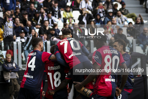 Cagliari midfielder Razvan Marin (18) celebrates with his teammates after scoring his goal to make it 1-1 during the Serie A football match...