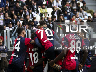 Cagliari midfielder Razvan Marin (18) celebrates with his teammates after scoring his goal to make it 1-1 during the Serie A football match...