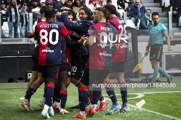 Cagliari midfielder Razvan Marin (18) celebrates with his teammates after scoring his goal to make it 1-1 during the Serie A football match...