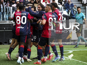 Cagliari midfielder Razvan Marin (18) celebrates with his teammates after scoring his goal to make it 1-1 during the Serie A football match...