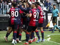 Cagliari midfielder Razvan Marin (18) celebrates with his teammates after scoring his goal to make it 1-1 during the Serie A football match...