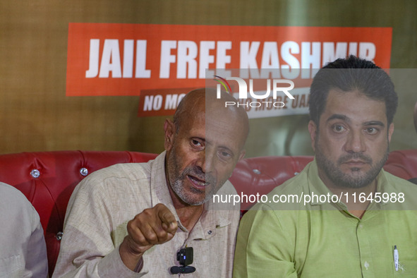 Member of Parliament Sheikh Abdul Rashid, also known as Engineer Rashid, (Right) speaks during a press conference in Srinagar, Jammu and Kas...