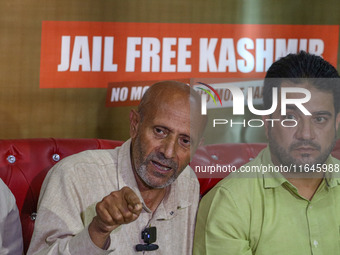 Member of Parliament Sheikh Abdul Rashid, also known as Engineer Rashid, (Right) speaks during a press conference in Srinagar, Jammu and Kas...