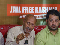 Member of Parliament Sheikh Abdul Rashid, also known as Engineer Rashid, (Right) speaks during a press conference in Srinagar, Jammu and Kas...