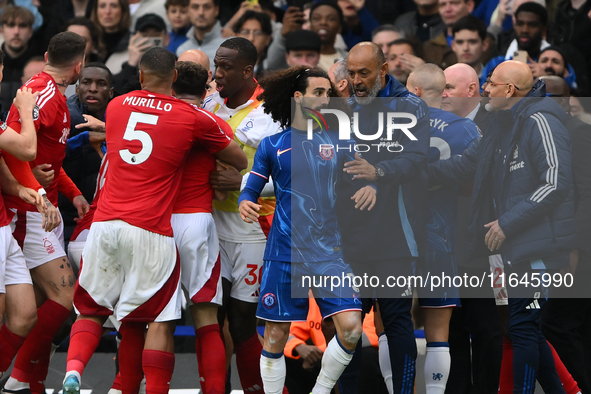 Nuno Espirito Santo, Nottingham Forest head coach, and Marc Cucurella of Chelsea during the Premier League match between Chelsea and Notting...