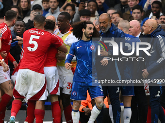 Nuno Espirito Santo, Nottingham Forest head coach, and Marc Cucurella of Chelsea during the Premier League match between Chelsea and Notting...