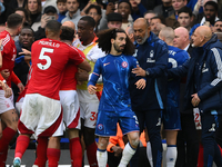 Nuno Espirito Santo, Nottingham Forest head coach, and Marc Cucurella of Chelsea during the Premier League match between Chelsea and Notting...