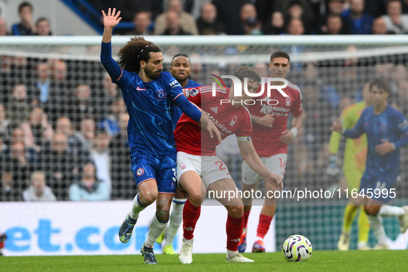 Ryan Yates of Nottingham Forest battles with Marc Cucurella of Chelsea during the Premier League match between Chelsea and Nottingham Forest...