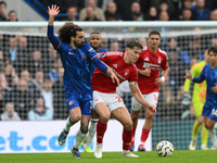 Ryan Yates of Nottingham Forest battles with Marc Cucurella of Chelsea during the Premier League match between Chelsea and Nottingham Forest...