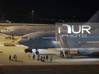 Evacuees land in Eindhoven, Netherlands, on October 4, 2024, from the Middle East. The first repatriation flight from Beirut includes around...