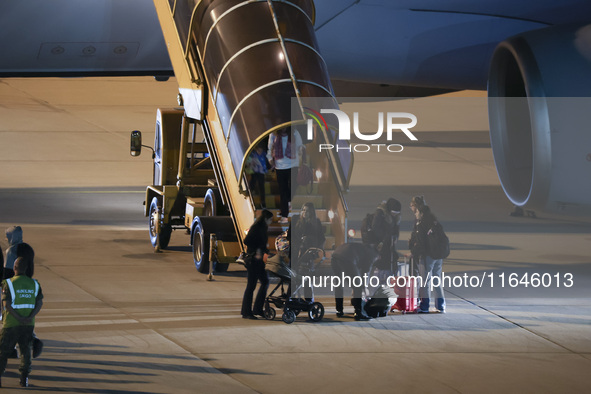 Evacuees land in Eindhoven, Netherlands, on October 4, 2024, from the Middle East. The first repatriation flight from Beirut includes around...