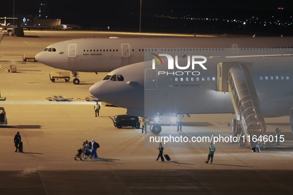 Evacuees land in Eindhoven, Netherlands, on October 4, 2024, from the Middle East. The first repatriation flight from Beirut includes around...