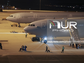 Evacuees land in Eindhoven, Netherlands, on October 4, 2024, from the Middle East. The first repatriation flight from Beirut includes around...