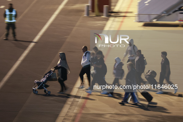 Evacuees land in Eindhoven, Netherlands, on October 4, 2024, from the Middle East. The first repatriation flight from Beirut includes around...