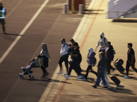 Evacuees land in Eindhoven, Netherlands, on October 4, 2024, from the Middle East. The first repatriation flight from Beirut includes around...