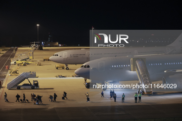 Evacuees land in Eindhoven, Netherlands, on October 4, 2024, from the Middle East. The first repatriation flight from Beirut includes around...