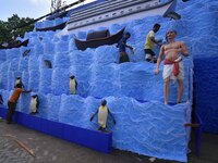 Workers make a pandal for the Durga Puja festival in Nagaon District, Assam, India, on October 7, 2024. (