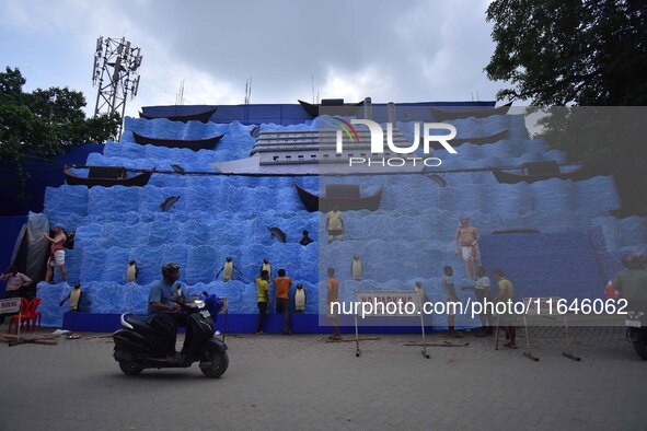 Workers make a pandal for the Durga Puja festival in Nagaon District, Assam, India, on October 7, 2024. 