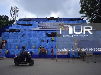 Workers make a pandal for the Durga Puja festival in Nagaon District, Assam, India, on October 7, 2024. (