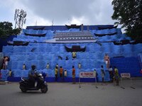 Workers make a pandal for the Durga Puja festival in Nagaon District, Assam, India, on October 7, 2024. (