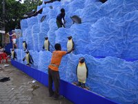 Workers make a pandal for the Durga Puja festival in Nagaon District, Assam, India, on October 7, 2024. (