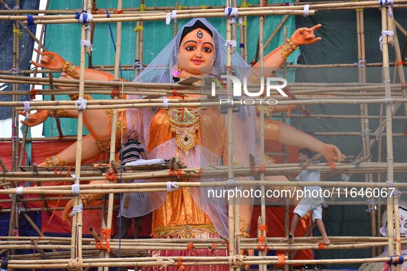 Artists make 51-foot idols of Goddess Durga for the upcoming Durga Puja festival at a pandal in Nagaon District, Assam, India, on October 7,...