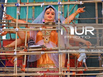 Artists make 51-foot idols of Goddess Durga for the upcoming Durga Puja festival at a pandal in Nagaon District, Assam, India, on October 7,...