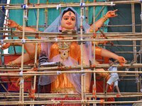 Artists make 51-foot idols of Goddess Durga for the upcoming Durga Puja festival at a pandal in Nagaon District, Assam, India, on October 7,...