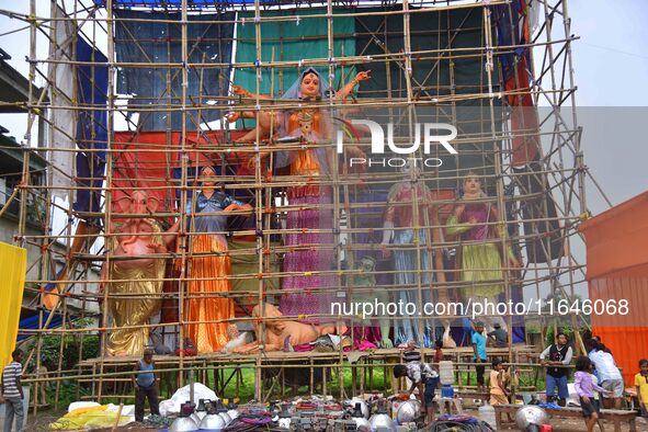 Artists make 51-foot idols of Goddess Durga for the upcoming Durga Puja festival at a pandal in Nagaon District, Assam, India, on October 7,...