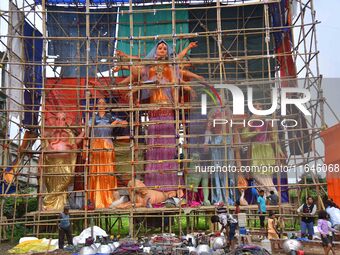 Artists make 51-foot idols of Goddess Durga for the upcoming Durga Puja festival at a pandal in Nagaon District, Assam, India, on October 7,...