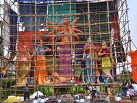 Artists make 51-foot idols of Goddess Durga for the upcoming Durga Puja festival at a pandal in Nagaon District, Assam, India, on October 7,...