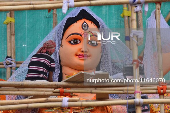 Artists make 51-foot idols of Goddess Durga for the upcoming Durga Puja festival at a pandal in Nagaon District, Assam, India, on October 7,...