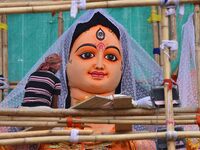 Artists make 51-foot idols of Goddess Durga for the upcoming Durga Puja festival at a pandal in Nagaon District, Assam, India, on October 7,...