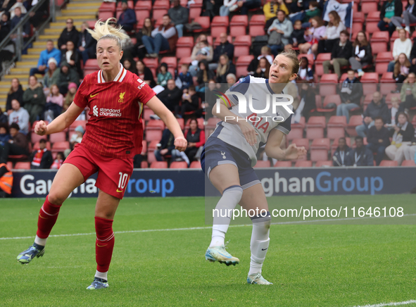 Sophie Roman Haug of Liverpool Women and Clare Hunt of Tottenham Hotspur Women are in action during the Barclays FA Women's Super League soc...