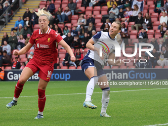 Sophie Roman Haug of Liverpool Women and Clare Hunt of Tottenham Hotspur Women are in action during the Barclays FA Women's Super League soc...