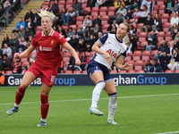 Sophie Roman Haug of Liverpool Women and Clare Hunt of Tottenham Hotspur Women are in action during the Barclays FA Women's Super League soc...