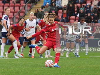 Marie Hobinger of Liverpool Women scores from the penalty spot during the Barclays FA Women's Super League soccer match between Tottenham Ho...