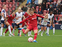 Marie Hobinger of Liverpool Women scores from the penalty spot during the Barclays FA Women's Super League soccer match between Tottenham Ho...