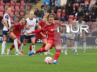 Marie Hobinger of Liverpool Women scores from the penalty spot during the Barclays FA Women's Super League soccer match between Tottenham Ho...