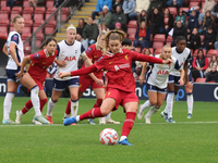 Marie Hobinger of Liverpool Women scores from the penalty spot during the Barclays FA Women's Super League soccer match between Tottenham Ho...