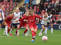 Marie Hobinger of Liverpool Women scores from the penalty spot during the Barclays FA Women's Super League soccer match between Tottenham Ho...