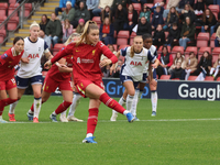 Marie Hobinger of Liverpool Women scores from the penalty spot during the Barclays FA Women's Super League soccer match between Tottenham Ho...