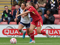 In London, England, on October 6, 2024, Lucy Parry of Liverpool Women (red) tussles with Hayley Raso of Tottenham Hotspur Women during the B...