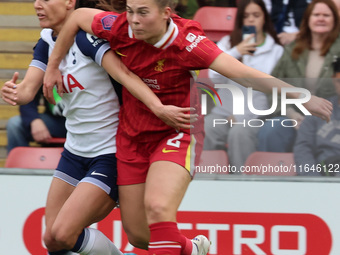 In London, England, on October 6, 2024, Lucy Parry of Liverpool Women (red) tussles with Hayley Raso of Tottenham Hotspur Women during the B...