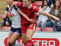 In London, England, on October 6, 2024, Lucy Parry of Liverpool Women (red) tussles with Hayley Raso of Tottenham Hotspur Women during the B...