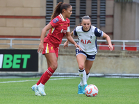 Taylor Hinds of Liverpool Women and Hayley Raso of Tottenham Hotspur Women play during the Barclays FA Women's Super League soccer match bet...