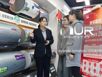 Consumers buy water heaters at an appliance trade-in promotion event in Handan, China, on October 7, 2024. (