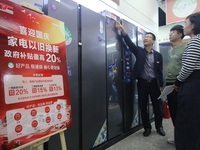 Consumers shop for refrigerators at a trade-in promotion for home appliances in Handan, China, on October 7, 2024. (